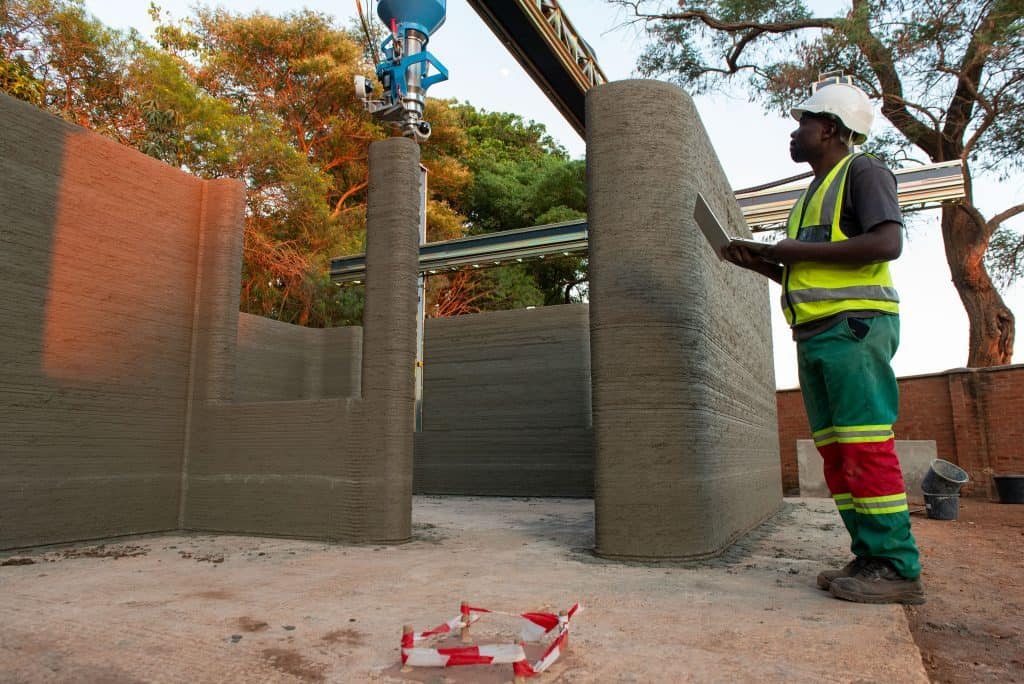 Worker on site with the BOD2 3D construction printer