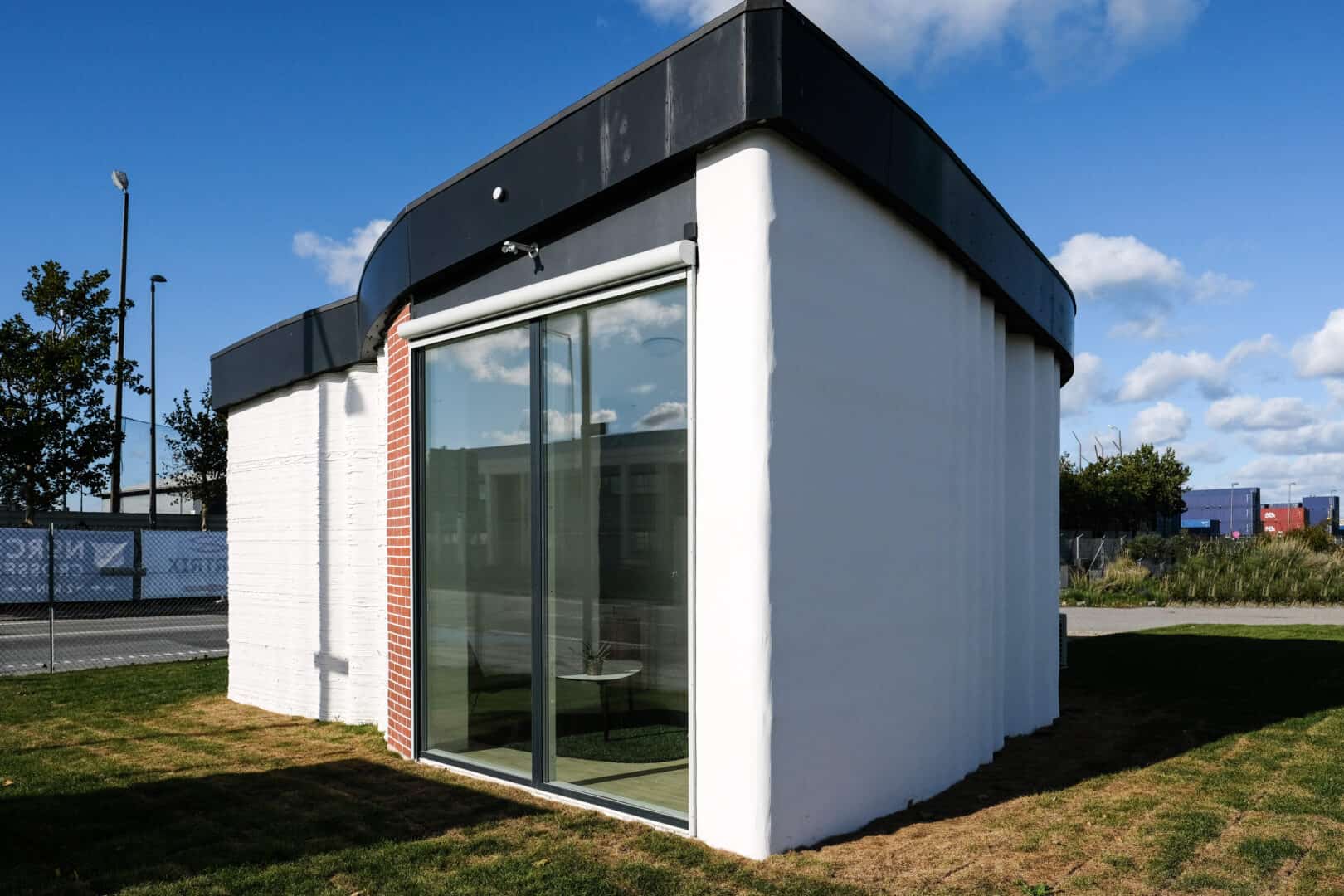 A small white 3D printed building in Copenhagen, Denmark