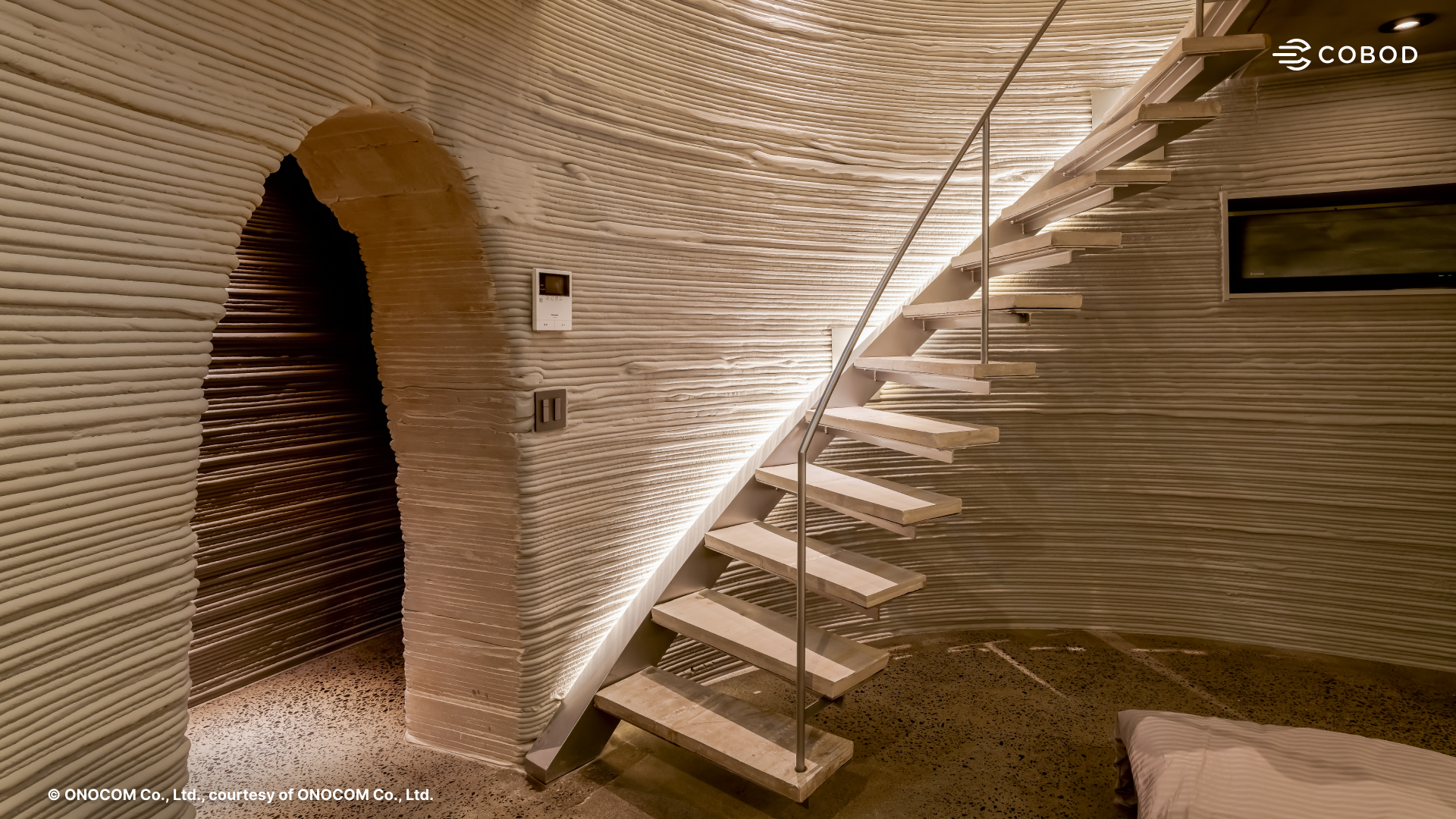 Cave-inspired architectural concept repeated throughout the building, made possible through advanced 3D printed geometry.