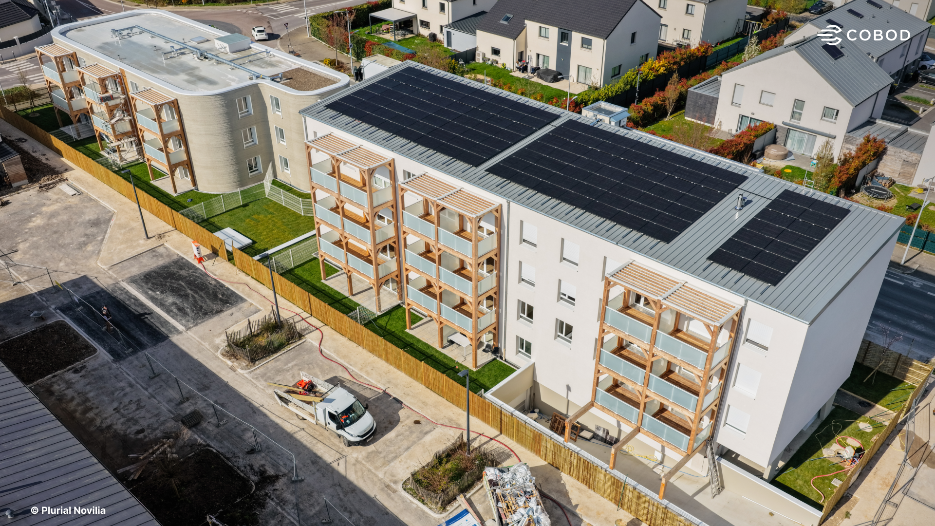 Aerial view of ViliaSprint² in Bezannes, France, showing the distinctive rounded geometry made possible by 3D concrete printing, a form that would carry significant cost premiums in conventional formwork construction.