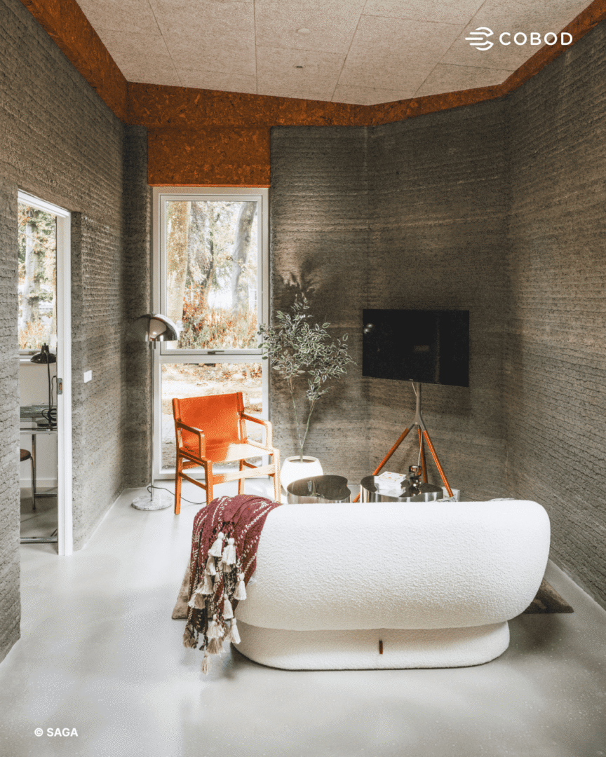 The lounge, with curved 3D-printed concrete walls.